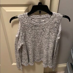 grey shoulder showing sweater